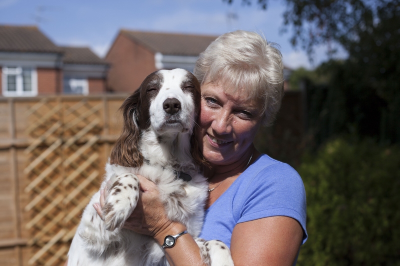 Flossie recovering with her owner at home.